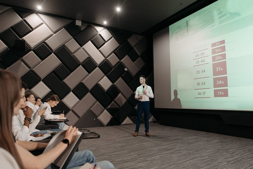 Professional business presentation in a modern conference room with attentive audience.